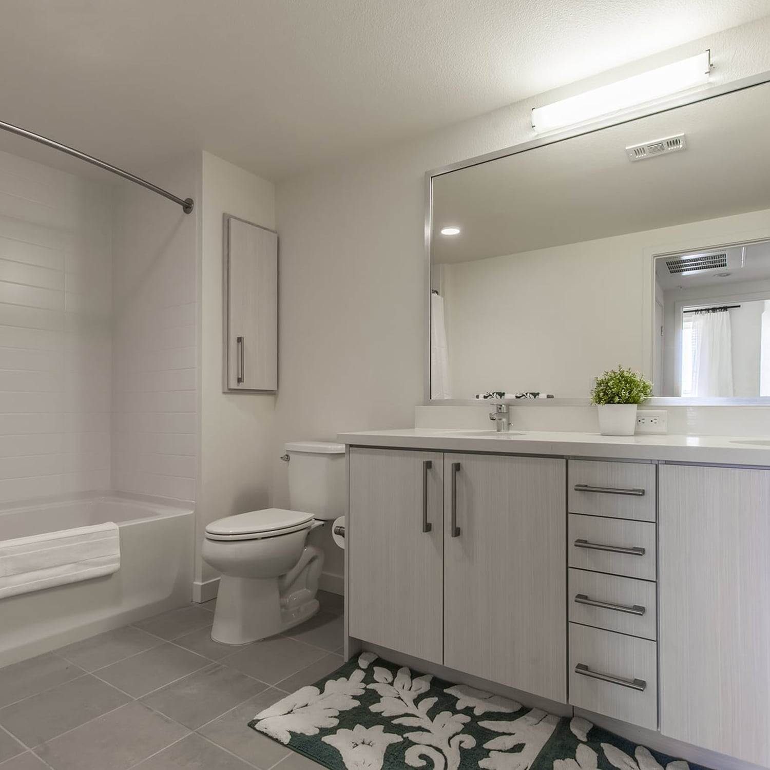Foster City CA Apartments-One Hundred Grand Bathroom with Large Tub Area, Spacious Vanity, and Lots of Counter and Cabinet Space